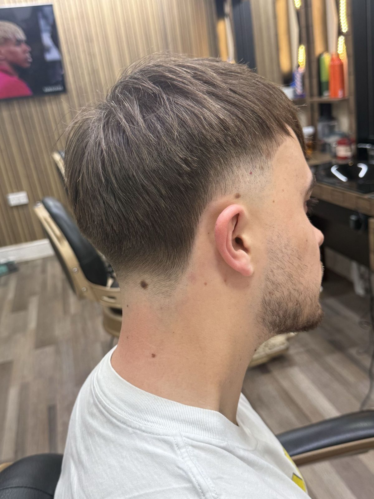 Textured crop with a mid fade, back three quarter view