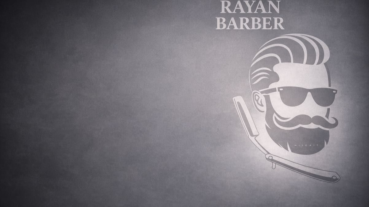 The Rayan Barber name and bearded man emblem on the shop wall