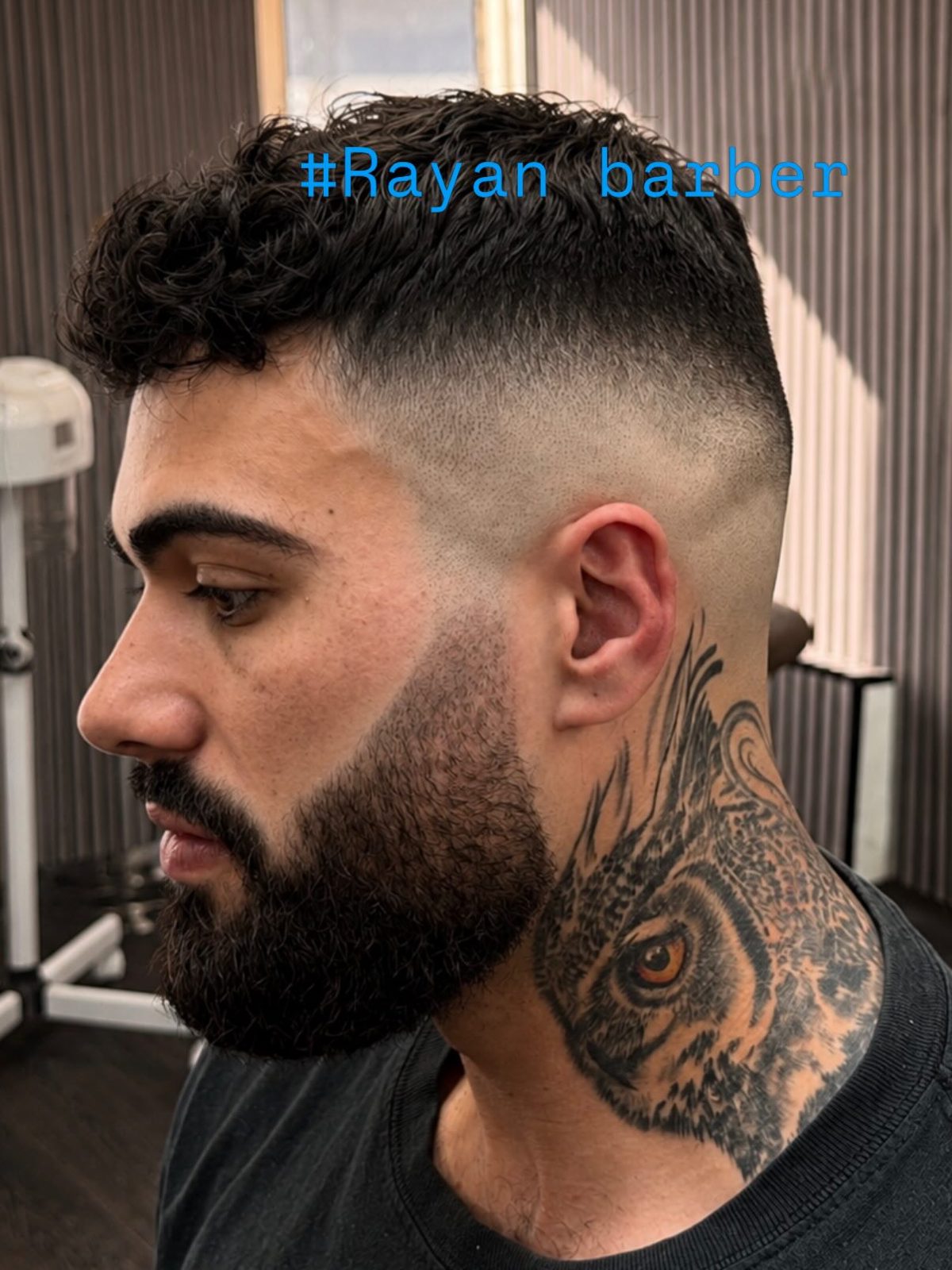 High skin fade with a lined up beard